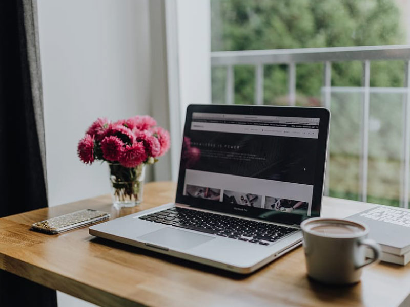 Modern home office table and laptop for remote work